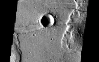 <h1>PIA09305:  Fractures</h1><div class="PIA09305" lang="en" style="width:551px;text-align:left;margin:auto;background-color:#000;padding:10px;max-height:150px;overflow:auto;"><p><a href="/figures/PIA09305_fig1.jpg"></a><br><b>Context image for PIA09305<br />Fractures</b></p><p>The fractures in this image are part of Memnonia Fossae. Large wrinkle ridges are being cut by the fractures.<p>Image information: VIS instrument. Latitude -23.2N, Longitude 200.9E. 17 meter/pixel resolution.</p><p>Please see the <a href="http://themis.asu.edu/terms" target="_blank">THEMIS Data Citation Note</a> for details on crediting THEMIS images.</p><p>Note: this THEMIS visual image has not been radiometrically nor geometrically calibrated for this preliminary release. An empirical correction has been performed to remove instrumental effects. A linear shift has been applied in the cross-track and down-track direction to approximate spacecraft and planetary motion. Fully calibrated and geometrically projected images will be released through the Planetary Data System in accordance with Project policies at a later time.</p><p>NASA's Jet Propulsion Laboratory manages the 2001 Mars Odyssey mission for NASA's Office of Space Science, Washington, D.C. The Thermal Emission Imaging System (THEMIS) was developed by Arizona State University, Tempe, in collaboration with Raytheon Santa Barbara Remote Sensing. The THEMIS investigation is led by Dr. Philip Christensen at Arizona State University. Lockheed Martin Astronautics, Denver, is the prime contractor for the Odyssey project, and developed and built the orbiter. Mission operations are conducted jointly from Lockheed Martin and from JPL, a division of the California Institute of Technology in Pasadena.</p><br /><br /><a href="http://photojournal.jpl.nasa.gov/catalog/PIA09305" onclick="window.open(this.href); return false;" title="Voir l'image 	 PIA09305:  Fractures	  sur le site de la NASA">Voir l'image 	 PIA09305:  Fractures	  sur le site de la NASA.</a></div>