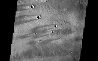 <h1>PIA09427:  Windstreaks</h1><div class="PIA09427" lang="en" style="width:555px;text-align:left;margin:auto;background-color:#000;padding:10px;max-height:150px;overflow:auto;"><p><a href="/figures/PIA09427_fig1.jpg"></a><br><b>Context image for PIA09427<br />Windstreaks</b></p><p>These windstreaks are located on lava flows from Arsia Mons.<p>Image information: VIS instrument. Latitude -10.9N, Longitude 225.3E. 18 meter/pixel resolution.</p><p>Please see the <a href="http://themis.asu.edu/terms" target="_blank">THEMIS Data Citation Note</a> for details on crediting THEMIS images.</p><p>Note: this THEMIS visual image has not been radiometrically nor geometrically calibrated for this preliminary release. An empirical correction has been performed to remove instrumental effects. A linear shift has been applied in the cross-track and down-track direction to approximate spacecraft and planetary motion. Fully calibrated and geometrically projected images will be released through the Planetary Data System in accordance with Project policies at a later time.</p><p>NASA's Jet Propulsion Laboratory manages the 2001 Mars Odyssey mission for NASA's Office of Space Science, Washington, D.C. The Thermal Emission Imaging System (THEMIS) was developed by Arizona State University, Tempe, in collaboration with Raytheon Santa Barbara Remote Sensing. The THEMIS investigation is led by Dr. Philip Christensen at Arizona State University. Lockheed Martin Astronautics, Denver, is the prime contractor for the Odyssey project, and developed and built the orbiter. Mission operations are conducted jointly from Lockheed Martin and from JPL, a division of the California Institute of Technology in Pasadena.</p><br /><br /><a href="http://photojournal.jpl.nasa.gov/catalog/PIA09427" onclick="window.open(this.href); return false;" title="Voir l'image 	 PIA09427:  Windstreaks	  sur le site de la NASA">Voir l'image 	 PIA09427:  Windstreaks	  sur le site de la NASA.</a></div>
