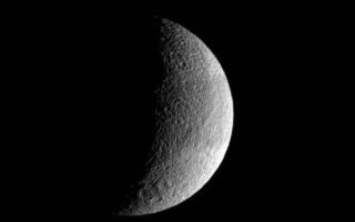 <h1>PIA09737:  Tethys Crescent</h1><div class="PIA09737" lang="en" style="width:549px;text-align:left;margin:auto;background-color:#000;padding:10px;max-height:150px;overflow:auto;"><p>The pockmarked crescent of Tethys displays slightly darker terrain in a band at its equator. The rim of the great crater Odysseus lurks on the terminator.</p><p>Lit terrain seen here is on the leading hemisphere of Tethys (1,071 kilometers, or 665 miles across). North is up.</p><p>The image was taken in visible light with the Cassini spacecraft wide-angle camera on Aug. 29, 2007. The view was obtained at a distance of approximately 56,000 kilometers (35,000 miles) from Tethys and at a Sun-Tethys-spacecraft, or phase, angle of 105 degrees. Image scale is 3 kilometers (2 miles) per pixel.</p><p>The Cassini-Huygens mission is a cooperative project of NASA, the European Space Agency and the Italian Space Agency. The Jet Propulsion Laboratory, a division of the California Institute of Technology in Pasadena, manages the mission for NASA's Science Mission Directorate, Washington, D.C. The Cassini orbiter and its two onboard cameras were designed, developed and assembled at JPL. The imaging operations center is based at the Space Science Institute in Boulder, Colo.</p><p>For more information about the Cassini-Huygens mission visit <a href="http://saturn.jpl.nasa.gov">http://saturn.jpl.nasa.gov/home/index.cfm</a>. The Cassini imaging team homepage is at <a href="http://ciclops.org">http://ciclops.org</a>.</p><br /><br /><a href="http://photojournal.jpl.nasa.gov/catalog/PIA09737" onclick="window.open(this.href); return false;" title="Voir l'image 	 PIA09737:  Tethys Crescent	  sur le site de la NASA">Voir l'image 	 PIA09737:  Tethys Crescent	  sur le site de la NASA.</a></div>