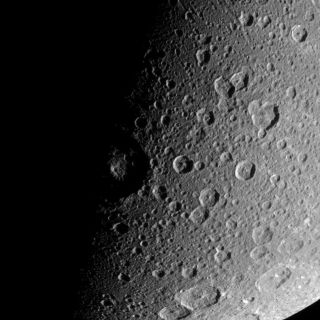 <h1>PIA09830:  Battered Dione</h1><div class="PIA09830" lang="en" style="width:800px;text-align:left;margin:auto;background-color:#000;padding:10px;max-height:150px;overflow:auto;"><p>The Cassini spacecraft looks down over high northern latitudes on Dione. </p><p>The view captures terrain stretching from about 30 degrees south latitude to about 65 degrees north latitude on the moon's Saturn-facing side. Cassini obtained this view from a position 48 degrees above the equator of Dione (1,126 kilometers, or 700 miles across). North is up.</p><p>The image was taken in visible light with the Cassini spacecraft narrow-angle camera on Jan. 3, 2008. The view was acquired at a distance of approximately 129,000 kilometers (80,000 miles) from Dione and at a Sun-Dione-spacecraft, or phase, angle of 87 degrees. Image scale is 767 meters (0.5 mile) per pixel.</p><p>The Cassini-Huygens mission is a cooperative project of NASA, the European Space Agency and the Italian Space Agency. The Jet Propulsion Laboratory, a division of the California Institute of Technology in Pasadena, manages the mission for NASA's Science Mission Directorate, Washington, D.C. The Cassini orbiter and its two onboard cameras were designed, developed and assembled at JPL. The imaging operations center is based at the Space Science Institute in Boulder, Colo.</p><p>For more information about the Cassini-Huygens mission visit <a href="http://saturn.jpl.nasa.gov">http://saturn.jpl.nasa.gov/home/index.cfm</a>. The Cassini imaging team homepage is at <a href="http://ciclops.org">http://ciclops.org</a>.<br /><br /><a href="http://photojournal.jpl.nasa.gov/catalog/PIA09830" onclick="window.open(this.href); return false;" title="Voir l'image 	 PIA09830:  Battered Dione	  sur le site de la NASA">Voir l'image 	 PIA09830:  Battered Dione	  sur le site de la NASA.</a></div>