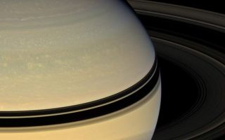 <h1>PIA09906:  Revealing Saturn's Colors</h1><div class="PIA09906" lang="en" style="width:800px;text-align:left;margin:auto;background-color:#000;padding:10px;max-height:150px;overflow:auto;"><p>Stately Saturn sits surrounded by its darkened disk of ice. An increasing range of hues has become visible in the northern hemisphere as spring approaches and the ring shadows slide southward.</p><p>This view looks toward the unilluminated side of the rings from about 17 degrees above the ringplane. Images taken using red, green and blue spectral filters were combined to create this natural color view. The images were acquired with the Cassini spacecraft wide-angle camera on April 15, 2008 at a distance of approximately 1.5 million kilometers (906,000 miles) from Saturn. Image scale is 84 kilometers (52 miles) per pixel.</p><p>The Cassini-Huygens mission is a cooperative project of NASA, the European Space Agency and the Italian Space Agency. The Jet Propulsion Laboratory, a division of the California Institute of Technology in Pasadena, manages the mission for NASA's Science Mission Directorate, Washington, D.C. The Cassini orbiter and its two onboard cameras were designed, developed and assembled at JPL. The imaging operations center is based at the Space Science Institute in Boulder, Colo.</p><p>For more information about the Cassini-Huygens mission visit <a href="http://saturn.jpl.nasa.gov" class="external free" target="wpext">http://saturn.jpl.nasa.gov/</a>. The Cassini imaging team homepage is at <a href="http://ciclops.org" class="external free" target="wpext">http://ciclops.org</a>.<br /><br /><a href="http://photojournal.jpl.nasa.gov/catalog/PIA09906" onclick="window.open(this.href); return false;" title="Voir l'image 	 PIA09906:  Revealing Saturn's Colors	  sur le site de la NASA">Voir l'image 	 PIA09906:  Revealing Saturn's Colors	  sur le site de la NASA.</a></div>