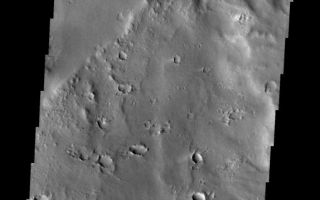 <h1>PIA09985:  More Apollinaris</h1><div class="PIA09985" lang="en" style="width:574px;text-align:left;margin:auto;background-color:#000;padding:10px;max-height:150px;overflow:auto;"><p><a href="/figures/PIA09985_fig1.jpg"></a><br><b>Context image for PIA09985<br />More Apollinaris</b></p><p>The major Martian dust storm of 2007 filled the sky with dust and produced conditions that prevented the THEMIS VIS camera from being able to image the surface. With no new images being acquired, we've dug into the archive to highlight some interesting areas on Mars. The this week's region is Apollinaris Patera. Apollinaris Patera is an old volcano that has undergone extensive erosion. This volcano is located north of Gusev Crater, the home of the rover called Spirit. Today's image shows the boundary between the base of the volcano and the wind eroded materials located NNW of Apollinaris Patera.<p>Image information: VIS instrument. Latitude -7.6N, Longitude 173.0E. 18 meter/pixel resolution.</p><p>Please see the <a href="http://themis.asu.edu/terms" target="_blank">THEMIS Data Citation Note</a> for details on crediting THEMIS images.</p><p>Note: this THEMIS visual image has not been radiometrically nor geometrically calibrated for this preliminary release. An empirical correction has been performed to remove instrumental effects. A linear shift has been applied in the cross-track and down-track direction to approximate spacecraft and planetary motion. Fully calibrated and geometrically projected images will be released through the Planetary Data System in accordance with Project policies at a later time.</p><p>NASA's Jet Propulsion Laboratory manages the 2001 Mars Odyssey mission for NASA's Office of Space Science, Washington, D.C. The Thermal Emission Imaging System (THEMIS) was developed by Arizona State University, Tempe, in collaboration with Raytheon Santa Barbara Remote Sensing. The THEMIS investigation is led by Dr. Philip Christensen at Arizona State University. Lockheed Martin Astronautics, Denver, is the prime contractor for the Odyssey project, and developed and built the orbiter. Mission operations are conducted jointly from Lockheed Martin and from JPL, a division of the California Institute of Technology in Pasadena.</p><br /><br /><a href="http://photojournal.jpl.nasa.gov/catalog/PIA09985" onclick="window.open(this.href); return false;" title="Voir l'image 	 PIA09985:  More Apollinaris	  sur le site de la NASA">Voir l'image 	 PIA09985:  More Apollinaris	  sur le site de la NASA.</a></div>