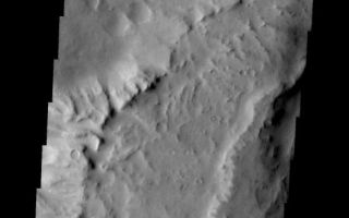 <h1>PIA09987:  Final Apollinaris</h1><div class="PIA09987" lang="en" style="width:531px;text-align:left;margin:auto;background-color:#000;padding:10px;max-height:150px;overflow:auto;"><p><a href="/figures/PIA09987_fig1.jpg"></a><br><b>Context image for PIA09987<br />Final Apollinaris</b></p><p>The major Martian dust storm of 2007 filled the sky with dust and produced conditions that prevented the THEMIS VIS camera from being able to image the surface. With no new images being acquired, we've dug into the archive to highlight some interesting areas on Mars. The this week's region is Apollinaris Patera. Apollinaris Patera is an old volcano that has undergone extensive erosion. This volcano is located north of Gusev Crater, the home of the rover called Spirit. Today's image shows the northwestern edge of the summit caldera.<p>Image information: VIS instrument. Latitude -8.3N, Longitude 173.6E. 18 meter/pixel resolution.</p><p>Please see the <a href="http://themis.asu.edu/terms" target="_blank">THEMIS Data Citation Note</a> for details on crediting THEMIS images.</p><p>Note: this THEMIS visual image has not been radiometrically nor geometrically calibrated for this preliminary release. An empirical correction has been performed to remove instrumental effects. A linear shift has been applied in the cross-track and down-track direction to approximate spacecraft and planetary motion. Fully calibrated and geometrically projected images will be released through the Planetary Data System in accordance with Project policies at a later time.</p><p>NASA's Jet Propulsion Laboratory manages the 2001 Mars Odyssey mission for NASA's Office of Space Science, Washington, D.C. The Thermal Emission Imaging System (THEMIS) was developed by Arizona State University, Tempe, in collaboration with Raytheon Santa Barbara Remote Sensing. The THEMIS investigation is led by Dr. Philip Christensen at Arizona State University. Lockheed Martin Astronautics, Denver, is the prime contractor for the Odyssey project, and developed and built the orbiter. Mission operations are conducted jointly from Lockheed Martin and from JPL, a division of the California Institute of Technology in Pasadena.</p><br /><br /><a href="http://photojournal.jpl.nasa.gov/catalog/PIA09987" onclick="window.open(this.href); return false;" title="Voir l'image 	 PIA09987:  Final Apollinaris	  sur le site de la NASA">Voir l'image 	 PIA09987:  Final Apollinaris	  sur le site de la NASA.</a></div>