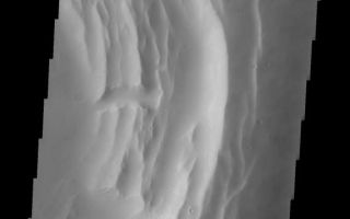 <h1>PIA09997:  Biblis Patera</h1><div class="PIA09997" lang="en" style="width:570px;text-align:left;margin:auto;background-color:#000;padding:10px;max-height:150px;overflow:auto;"><p><a href="/figures/PIA09997_fig1.jpg"></a><br><b>Context image for PIA09997<br />Biblis Patera</b></p><p>This VIS image shows the summit of Biblis Patera.<p>Image information: VIS instrument. Latitude 2.4N, Longitude 236.6E. 18 meter/pixel resolution.</p><p>Please see the <a href="http://themis.asu.edu/terms" target="_blank">THEMIS Data Citation Note</a> for details on crediting THEMIS images.</p><p>Note: this THEMIS visual image has not been radiometrically nor geometrically calibrated for this preliminary release. An empirical correction has been performed to remove instrumental effects. A linear shift has been applied in the cross-track and down-track direction to approximate spacecraft and planetary motion. Fully calibrated and geometrically projected images will be released through the Planetary Data System in accordance with Project policies at a later time.</p><p>NASA's Jet Propulsion Laboratory manages the 2001 Mars Odyssey mission for NASA's Office of Space Science, Washington, D.C. The Thermal Emission Imaging System (THEMIS) was developed by Arizona State University, Tempe, in collaboration with Raytheon Santa Barbara Remote Sensing. The THEMIS investigation is led by Dr. Philip Christensen at Arizona State University. Lockheed Martin Astronautics, Denver, is the prime contractor for the Odyssey project, and developed and built the orbiter. Mission operations are conducted jointly from Lockheed Martin and from JPL, a division of the California Institute of Technology in Pasadena.</p><br /><br /><a href="http://photojournal.jpl.nasa.gov/catalog/PIA09997" onclick="window.open(this.href); return false;" title="Voir l'image 	 PIA09997:  Biblis Patera	  sur le site de la NASA">Voir l'image 	 PIA09997:  Biblis Patera	  sur le site de la NASA.</a></div>