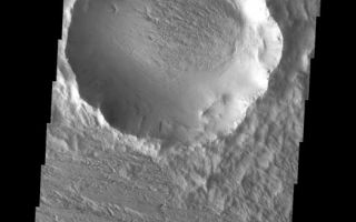 <h1>PIA10034:  Back in View</h1><div class="PIA10034" lang="en" style="width:524px;text-align:left;margin:auto;background-color:#000;padding:10px;max-height:150px;overflow:auto;"><p><a href="/figures/PIA10034_fig1.jpg"></a><br><b>Context image for PIA10034<br />Back In View</b></p><p>At some point in the past the majority of this crater and its ejecta were covered by a layer of loose material. The wind has been winnowing away the loose material to reveal the old crater and it's ejecta blanket. This process is called exhumation.<p>Image information: VIS instrument. Latitude 11.5N, Longitude 219.4E. 18 meter/pixel resolution.</p><p>Please see the <a href="http://themis.asu.edu/terms" target="_blank">THEMIS Data Citation Note</a> for details on crediting THEMIS images.</p><p>Note: this THEMIS visual image has not been radiometrically nor geometrically calibrated for this preliminary release. An empirical correction has been performed to remove instrumental effects. A linear shift has been applied in the cross-track and down-track direction to approximate spacecraft and planetary motion. Fully calibrated and geometrically projected images will be released through the Planetary Data System in accordance with Project policies at a later time.</p><p>NASA's Jet Propulsion Laboratory manages the 2001 Mars Odyssey mission for NASA's Office of Space Science, Washington, D.C. The Thermal Emission Imaging System (THEMIS) was developed by Arizona State University, Tempe, in collaboration with Raytheon Santa Barbara Remote Sensing. The THEMIS investigation is led by Dr. Philip Christensen at Arizona State University. Lockheed Martin Astronautics, Denver, is the prime contractor for the Odyssey project, and developed and built the orbiter. Mission operations are conducted jointly from Lockheed Martin and from JPL, a division of the California Institute of Technology in Pasadena.</p><br /><br /><a href="http://photojournal.jpl.nasa.gov/catalog/PIA10034" onclick="window.open(this.href); return false;" title="Voir l'image 	 PIA10034:  Back in View	  sur le site de la NASA">Voir l'image 	 PIA10034:  Back in View	  sur le site de la NASA.</a></div>