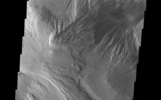 <h1>PIA10057:  Ophis Chasma</h1><div class="PIA10057" lang="en" style="width:554px;text-align:left;margin:auto;background-color:#000;padding:10px;max-height:150px;overflow:auto;"><p><a href="/figures/PIA10057_fig1.jpg"></a><br><b>Context image for PIA10057<br />Ophis Chasma</b></p><p>This VIS image shows a portion of the floor of Ophir Chasma. At the top of the frame is a landslide deposit. In the center is a wind and perhaps water eroded highland. At the bottom part of the image wind appears to be the main agent of erosion.<p>Image information: VIS instrument. Latitude -3.7N, Longitude 287.0E. 18 meter/pixel resolution.</p><p>Please see the <a href="http://themis.asu.edu/terms" target="_blank">THEMIS Data Citation Note</a> for details on crediting THEMIS images.</p><p>Note: this THEMIS visual image has not been radiometrically nor geometrically calibrated for this preliminary release. An empirical correction has been performed to remove instrumental effects. A linear shift has been applied in the cross-track and down-track direction to approximate spacecraft and planetary motion. Fully calibrated and geometrically projected images will be released through the Planetary Data System in accordance with Project policies at a later time.</p><p>NASA's Jet Propulsion Laboratory manages the 2001 Mars Odyssey mission for NASA's Office of Space Science, Washington, D.C. The Thermal Emission Imaging System (THEMIS) was developed by Arizona State University, Tempe, in collaboration with Raytheon Santa Barbara Remote Sensing. The THEMIS investigation is led by Dr. Philip Christensen at Arizona State University. Lockheed Martin Astronautics, Denver, is the prime contractor for the Odyssey project, and developed and built the orbiter. Mission operations are conducted jointly from Lockheed Martin and from JPL, a division of the California Institute of Technology in Pasadena.</p><br /><br /><a href="http://photojournal.jpl.nasa.gov/catalog/PIA10057" onclick="window.open(this.href); return false;" title="Voir l'image 	 PIA10057:  Ophis Chasma	  sur le site de la NASA">Voir l'image 	 PIA10057:  Ophis Chasma	  sur le site de la NASA.</a></div>