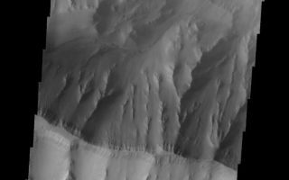 <h1>PIA10269:  Landslide</h1><div class="PIA10269" lang="en" style="width:572px;text-align:left;margin:auto;background-color:#000;padding:10px;max-height:150px;overflow:auto;"><p><a href="/figures/PIA10269_fig1.jpg"></a><br><b>Context image for PIA10269<br />Landslide</b></p><p>Although fog and dust partially obscure the floor of Coprates Chasma, a landslide deposit is visible in this image.<p>Image information: VIS instrument. Latitude -14.6N, Longitude 306.0E. 17 meter/pixel resolution.</p><p>Please see the <a href="http://themis.asu.edu/terms" target="_blank">THEMIS Data Citation Note</a> for details on crediting THEMIS images.</p><p>Note: this THEMIS visual image has not been radiometrically nor geometrically calibrated for this preliminary release. An empirical correction has been performed to remove instrumental effects. A linear shift has been applied in the cross-track and down-track direction to approximate spacecraft and planetary motion. Fully calibrated and geometrically projected images will be released through the Planetary Data System in accordance with Project policies at a later time.</p><p>NASA's Jet Propulsion Laboratory manages the 2001 Mars Odyssey mission for NASA's Office of Space Science, Washington, D.C. The Thermal Emission Imaging System (THEMIS) was developed by Arizona State University, Tempe, in collaboration with Raytheon Santa Barbara Remote Sensing. The THEMIS investigation is led by Dr. Philip Christensen at Arizona State University. Lockheed Martin Astronautics, Denver, is the prime contractor for the Odyssey project, and developed and built the orbiter. Mission operations are conducted jointly from Lockheed Martin and from JPL, a division of the California Institute of Technology in Pasadena.</p><br /><br /><a href="http://photojournal.jpl.nasa.gov/catalog/PIA10269" onclick="window.open(this.href); return false;" title="Voir l'image 	 PIA10269:  Landslide	  sur le site de la NASA">Voir l'image 	 PIA10269:  Landslide	  sur le site de la NASA.</a></div>