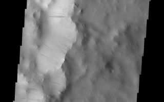 <h1>PIA10284:  Dark Slope Streaks</h1><div class="PIA10284" lang="en" style="width:575px;text-align:left;margin:auto;background-color:#000;padding:10px;max-height:150px;overflow:auto;"><p>These dark slope streaks are located within a small unnamed crater on the southern rim of Tikhonravov Crater.<p>Image information: VIS instrument. Latitude 10.6N, Longitude 37.5E. 18 meter/pixel resolution.</p><p>Please see the <a href="http://themis.asu.edu/terms" target="_blank">THEMIS Data Citation Note</a> for details on crediting THEMIS images.</p><p>Note: this THEMIS visual image has not been radiometrically nor geometrically calibrated for this preliminary release. An empirical correction has been performed to remove instrumental effects. A linear shift has been applied in the cross-track and down-track direction to approximate spacecraft and planetary motion. Fully calibrated and geometrically projected images will be released through the Planetary Data System in accordance with Project policies at a later time.</p><p>NASA's Jet Propulsion Laboratory manages the 2001 Mars Odyssey mission for NASA's Office of Space Science, Washington, D.C. The Thermal Emission Imaging System (THEMIS) was developed by Arizona State University, Tempe, in collaboration with Raytheon Santa Barbara Remote Sensing. The THEMIS investigation is led by Dr. Philip Christensen at Arizona State University. Lockheed Martin Astronautics, Denver, is the prime contractor for the Odyssey project, and developed and built the orbiter. Mission operations are conducted jointly from Lockheed Martin and from JPL, a division of the California Institute of Technology in Pasadena.<br /><br /><a href="http://photojournal.jpl.nasa.gov/catalog/PIA10284" onclick="window.open(this.href); return false;" title="Voir l'image 	 PIA10284:  Dark Slope Streaks	  sur le site de la NASA">Voir l'image 	 PIA10284:  Dark Slope Streaks	  sur le site de la NASA.</a></div>