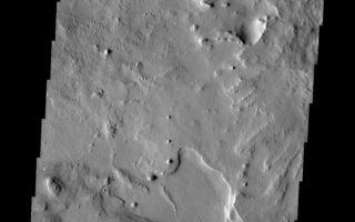 <h1>PIA10296:  Small Scale Features</h1><div class="PIA10296" lang="en" style="width:558px;text-align:left;margin:auto;background-color:#000;padding:10px;max-height:150px;overflow:auto;"><p><a href="/figures/PIA10296_fig1.jpg"></a><br><b>Context image for PIA10296<br />Small Scale Features </b></p><p>This VIS image shows a portion of Arabia Terra. There is an impact crater just out of the frame to the right and a larger one south of the frame. If one looks closely layering can be seen in the ejecta of both craters. There is also a region of orthogonal ridges.<p>Image information: VIS instrument. Latitude 15.6N, Longitude 20.7E. 18 meter/pixel resolution.</p><p>Please see the <a href="http://themis.asu.edu/terms" target="_blank">THEMIS Data Citation Note</a> for details on crediting THEMIS images.</p><p>Note: this THEMIS visual image has not been radiometrically nor geometrically calibrated for this preliminary release. An empirical correction has been performed to remove instrumental effects. A linear shift has been applied in the cross-track and down-track direction to approximate spacecraft and planetary motion. Fully calibrated and geometrically projected images will be released through the Planetary Data System in accordance with Project policies at a later time.</p><p>NASA's Jet Propulsion Laboratory manages the 2001 Mars Odyssey mission for NASA's Office of Space Science, Washington, D.C. The Thermal Emission Imaging System (THEMIS) was developed by Arizona State University, Tempe, in collaboration with Raytheon Santa Barbara Remote Sensing. The THEMIS investigation is led by Dr. Philip Christensen at Arizona State University. Lockheed Martin Astronautics, Denver, is the prime contractor for the Odyssey project, and developed and built the orbiter. Mission operations are conducted jointly from Lockheed Martin and from JPL, a division of the California Institute of Technology in Pasadena.<br /><br /><a href="http://photojournal.jpl.nasa.gov/catalog/PIA10296" onclick="window.open(this.href); return false;" title="Voir l'image 	 PIA10296:  Small Scale Features	  sur le site de la NASA">Voir l'image 	 PIA10296:  Small Scale Features	  sur le site de la NASA.</a></div>