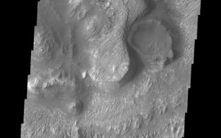 <h1>PIA10300:  Ganges Chasma</h1><div class="PIA10300" lang="en" style="width:554px;text-align:left;margin:auto;background-color:#000;padding:10px;max-height:150px;overflow:auto;"><p><a href="/figures/PIA10300_fig1.jpg"></a><br><b>Context image for PIA10300<br />Ganges Chasma</b></p><p>This VIS image shows a portion of the floor of Ganges Chasma. Many different features are shown in this image, including dunes, layered deposits, and wind eroded materials.<p>Image information: VIS instrument. Latitude -7.2N, Longitude 311.3E. 18 meter/pixel resolution.</p><p>Please see the <a href="http://themis.asu.edu/terms" target="_blank">THEMIS Data Citation Note</a> for details on crediting THEMIS images.</p><p>Note: this THEMIS visual image has not been radiometrically nor geometrically calibrated for this preliminary release. An empirical correction has been performed to remove instrumental effects. A linear shift has been applied in the cross-track and down-track direction to approximate spacecraft and planetary motion. Fully calibrated and geometrically projected images will be released through the Planetary Data System in accordance with Project policies at a later time.</p><p>NASA's Jet Propulsion Laboratory manages the 2001 Mars Odyssey mission for NASA's Office of Space Science, Washington, D.C. The Thermal Emission Imaging System (THEMIS) was developed by Arizona State University, Tempe, in collaboration with Raytheon Santa Barbara Remote Sensing. The THEMIS investigation is led by Dr. Philip Christensen at Arizona State University. Lockheed Martin Astronautics, Denver, is the prime contractor for the Odyssey project, and developed and built the orbiter. Mission operations are conducted jointly from Lockheed Martin and from JPL, a division of the California Institute of Technology in Pasadena.<br /><br /><a href="http://photojournal.jpl.nasa.gov/catalog/PIA10300" onclick="window.open(this.href); return false;" title="Voir l'image 	 PIA10300:  Ganges Chasma	  sur le site de la NASA">Voir l'image 	 PIA10300:  Ganges Chasma	  sur le site de la NASA.</a></div>