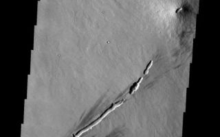 <h1>PIA10301:  Small Volcano</h1><div class="PIA10301" lang="en" style="width:548px;text-align:left;margin:auto;background-color:#000;padding:10px;max-height:150px;overflow:auto;"><p><a href="/figures/PIA10301_fig1.jpg"></a><br><b>Context image for PIA10301<br />Small Volcano</b></p><p>This small volcanic construct is located in the Tharsis region. The linear depression in the lower part of the frame was likely a vent for lava flows. The summit vent of the volcano appears to align with the linear vent.<p>Image information: VIS instrument. Latitude -1.7N, Longitude 254.3E. 18 meter/pixel resolution.</p><p>Please see the <a href="http://themis.asu.edu/terms" target="_blank">THEMIS Data Citation Note</a> for details on crediting THEMIS images.</p><p>Note: this THEMIS visual image has not been radiometrically nor geometrically calibrated for this preliminary release. An empirical correction has been performed to remove instrumental effects. A linear shift has been applied in the cross-track and down-track direction to approximate spacecraft and planetary motion. Fully calibrated and geometrically projected images will be released through the Planetary Data System in accordance with Project policies at a later time.</p><p>NASA's Jet Propulsion Laboratory manages the 2001 Mars Odyssey mission for NASA's Office of Space Science, Washington, D.C. The Thermal Emission Imaging System (THEMIS) was developed by Arizona State University, Tempe, in collaboration with Raytheon Santa Barbara Remote Sensing. The THEMIS investigation is led by Dr. Philip Christensen at Arizona State University. Lockheed Martin Astronautics, Denver, is the prime contractor for the Odyssey project, and developed and built the orbiter. Mission operations are conducted jointly from Lockheed Martin and from JPL, a division of the California Institute of Technology in Pasadena.<br /><br /><a href="http://photojournal.jpl.nasa.gov/catalog/PIA10301" onclick="window.open(this.href); return false;" title="Voir l'image 	 PIA10301:  Small Volcano	  sur le site de la NASA">Voir l'image 	 PIA10301:  Small Volcano	  sur le site de la NASA.</a></div>