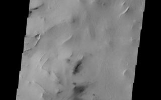 <h1>PIA10304:  Hellas Dunes</h1><div class="PIA10304" lang="en" style="width:549px;text-align:left;margin:auto;background-color:#000;padding:10px;max-height:150px;overflow:auto;"><p><a href="/figures/PIA10304_fig1.jpg"></a><br><b>Context image for PIA10304<br />Hellas Dunes</b></p><p>These small, dark dunes are located in Hellas Basin, within a region of chaotic terrain.<p>Image information: VIS instrument. Latitude -48.5N, Longitude 67.7E. 17 meter/pixel resolution.</p><p>Please see the <a href="http://themis.asu.edu/terms" target="_blank">THEMIS Data Citation Note</a> for details on crediting THEMIS images.</p><p>Note: this THEMIS visual image has not been radiometrically nor geometrically calibrated for this preliminary release. An empirical correction has been performed to remove instrumental effects. A linear shift has been applied in the cross-track and down-track direction to approximate spacecraft and planetary motion. Fully calibrated and geometrically projected images will be released through the Planetary Data System in accordance with Project policies at a later time.</p><p>NASA's Jet Propulsion Laboratory manages the 2001 Mars Odyssey mission for NASA's Office of Space Science, Washington, D.C. The Thermal Emission Imaging System (THEMIS) was developed by Arizona State University, Tempe, in collaboration with Raytheon Santa Barbara Remote Sensing. The THEMIS investigation is led by Dr. Philip Christensen at Arizona State University. Lockheed Martin Astronautics, Denver, is the prime contractor for the Odyssey project, and developed and built the orbiter. Mission operations are conducted jointly from Lockheed Martin and from JPL, a division of the California Institute of Technology in Pasadena.<br /><br /><a href="http://photojournal.jpl.nasa.gov/catalog/PIA10304" onclick="window.open(this.href); return false;" title="Voir l'image 	 PIA10304:  Hellas Dunes	  sur le site de la NASA">Voir l'image 	 PIA10304:  Hellas Dunes	  sur le site de la NASA.</a></div>