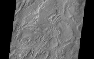 <h1>PIA10308:  Hellas Basin</h1><div class="PIA10308" lang="en" style="width:541px;text-align:left;margin:auto;background-color:#000;padding:10px;max-height:150px;overflow:auto;"><p><a href="/figures/PIA10308_fig1.jpg"></a><br><b>Context image for PIA10308<br />Hellas Basin</b></p><p>This interesting image shows a small portion of the western floor of Hellas Basin. The curved, broad ridges are separated by lower elevations filled with smaller, linear ridges.<p>Image information: VIS instrument. Latitude -38.2N, Longitude 53.3E. 17 meter/pixel resolution.</p><p>Please see the <a href="http://themis.asu.edu/terms" target="_blank">THEMIS Data Citation Note</a> for details on crediting THEMIS images.</p><p>Note: this THEMIS visual image has not been radiometrically nor geometrically calibrated for this preliminary release. An empirical correction has been performed to remove instrumental effects. A linear shift has been applied in the cross-track and down-track direction to approximate spacecraft and planetary motion. Fully calibrated and geometrically projected images will be released through the Planetary Data System in accordance with Project policies at a later time.</p><p>NASA's Jet Propulsion Laboratory manages the 2001 Mars Odyssey mission for NASA's Office of Space Science, Washington, D.C. The Thermal Emission Imaging System (THEMIS) was developed by Arizona State University, Tempe, in collaboration with Raytheon Santa Barbara Remote Sensing. The THEMIS investigation is led by Dr. Philip Christensen at Arizona State University. Lockheed Martin Astronautics, Denver, is the prime contractor for the Odyssey project, and developed and built the orbiter. Mission operations are conducted jointly from Lockheed Martin and from JPL, a division of the California Institute of Technology in Pasadena.<br /><br /><a href="http://photojournal.jpl.nasa.gov/catalog/PIA10308" onclick="window.open(this.href); return false;" title="Voir l'image 	 PIA10308:  Hellas Basin	  sur le site de la NASA">Voir l'image 	 PIA10308:  Hellas Basin	  sur le site de la NASA.</a></div>