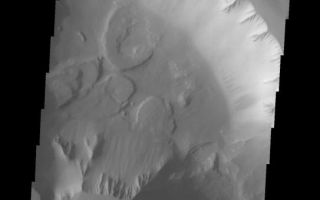 <h1>PIA10319:  Noctis Labyrinthus</h1><div class="PIA10319" lang="en" style="width:543px;text-align:left;margin:auto;background-color:#000;padding:10px;max-height:150px;overflow:auto;"><p><a href="/figures/PIA10319_fig1.jpg"></a><br><b>Context image for PIA10319<br />Noctis Labyrinthus</b></p><p>This group of landslides is located within Noctis Labyrinthus.<p>Image information: VIS instrument. Latitude -13.0N, Longitude 262.9E. 18 meter/pixel resolution.</p><p>Please see the <a href="http://themis.asu.edu/terms" target="_blank">THEMIS Data Citation Note</a> for details on crediting THEMIS images.</p><p>Note: this THEMIS visual image has not been radiometrically nor geometrically calibrated for this preliminary release. An empirical correction has been performed to remove instrumental effects. A linear shift has been applied in the cross-track and down-track direction to approximate spacecraft and planetary motion. Fully calibrated and geometrically projected images will be released through the Planetary Data System in accordance with Project policies at a later time.</p><p>NASA's Jet Propulsion Laboratory manages the 2001 Mars Odyssey mission for NASA's Office of Space Science, Washington, D.C. The Thermal Emission Imaging System (THEMIS) was developed by Arizona State University, Tempe, in collaboration with Raytheon Santa Barbara Remote Sensing. The THEMIS investigation is led by Dr. Philip Christensen at Arizona State University. Lockheed Martin Astronautics, Denver, is the prime contractor for the Odyssey project, and developed and built the orbiter. Mission operations are conducted jointly from Lockheed Martin and from JPL, a division of the California Institute of Technology in Pasadena.<br /><br /><a href="http://photojournal.jpl.nasa.gov/catalog/PIA10319" onclick="window.open(this.href); return false;" title="Voir l'image 	 PIA10319:  Noctis Labyrinthus	  sur le site de la NASA">Voir l'image 	 PIA10319:  Noctis Labyrinthus	  sur le site de la NASA.</a></div>