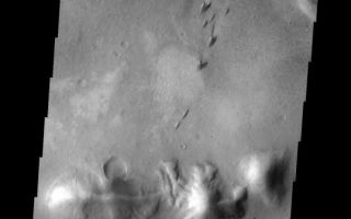 <h1>PIA10321:  Arkhangelsky Dunes</h1><div class="PIA10321" lang="en" style="width:538px;text-align:left;margin:auto;background-color:#000;padding:10px;max-height:150px;overflow:auto;"><p><a href="/figures/PIA10321_fig1.jpg"></a><br><b>Context image for PIA10321<br />Arkhangelsky Dunes</b></p><p>These individual dunes form a dune field on the floor of Arkhangelsky Crater.<p>Image information: VIS instrument. Latitude -41.1N, Longitude 335.2E. 17 meter/pixel resolution.</p><p>Please see the <a href="http://themis.asu.edu/terms" target="_blank">THEMIS Data Citation Note</a> for details on crediting THEMIS images.</p><p>Note: this THEMIS visual image has not been radiometrically nor geometrically calibrated for this preliminary release. An empirical correction has been performed to remove instrumental effects. A linear shift has been applied in the cross-track and down-track direction to approximate spacecraft and planetary motion. Fully calibrated and geometrically projected images will be released through the Planetary Data System in accordance with Project policies at a later time.</p><p>NASA's Jet Propulsion Laboratory manages the 2001 Mars Odyssey mission for NASA's Office of Space Science, Washington, D.C. The Thermal Emission Imaging System (THEMIS) was developed by Arizona State University, Tempe, in collaboration with Raytheon Santa Barbara Remote Sensing. The THEMIS investigation is led by Dr. Philip Christensen at Arizona State University. Lockheed Martin Astronautics, Denver, is the prime contractor for the Odyssey project, and developed and built the orbiter. Mission operations are conducted jointly from Lockheed Martin and from JPL, a division of the California Institute of Technology in Pasadena.<br /><br /><a href="http://photojournal.jpl.nasa.gov/catalog/PIA10321" onclick="window.open(this.href); return false;" title="Voir l'image 	 PIA10321:  Arkhangelsky Dunes	  sur le site de la NASA">Voir l'image 	 PIA10321:  Arkhangelsky Dunes	  sur le site de la NASA.</a></div>