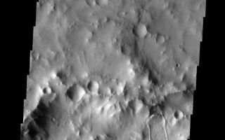 <h1>PIA10328:  Montevallo Crater</h1><div class="PIA10328" lang="en" style="width:562px;text-align:left;margin:auto;background-color:#000;padding:10px;max-height:150px;overflow:auto;"><p><a href="/figures/PIA10328_fig1.jpg"></a><br><b>Context image for PIA10328<br />Montevallo Crater</b></p><p>This VIS image shows a landslide deposit on the northern rim of Montevallo Crater.<p>Image information: VIS instrument. Latitude 15.7N, Longitude 305.7E. 18 meter/pixel resolution.</p><p>Please see the <a href="http://themis.asu.edu/terms" target="_blank">THEMIS Data Citation Note</a> for details on crediting THEMIS images.</p><p>Note: this THEMIS visual image has not been radiometrically nor geometrically calibrated for this preliminary release. An empirical correction has been performed to remove instrumental effects. A linear shift has been applied in the cross-track and down-track direction to approximate spacecraft and planetary motion. Fully calibrated and geometrically projected images will be released through the Planetary Data System in accordance with Project policies at a later time.</p><p>NASA's Jet Propulsion Laboratory manages the 2001 Mars Odyssey mission for NASA's Office of Space Science, Washington, D.C. The Thermal Emission Imaging System (THEMIS) was developed by Arizona State University, Tempe, in collaboration with Raytheon Santa Barbara Remote Sensing. The THEMIS investigation is led by Dr. Philip Christensen at Arizona State University. Lockheed Martin Astronautics, Denver, is the prime contractor for the Odyssey project, and developed and built the orbiter. Mission operations are conducted jointly from Lockheed Martin and from JPL, a division of the California Institute of Technology in Pasadena.<br /><br /><a href="http://photojournal.jpl.nasa.gov/catalog/PIA10328" onclick="window.open(this.href); return false;" title="Voir l'image 	 PIA10328:  Montevallo Crater	  sur le site de la NASA">Voir l'image 	 PIA10328:  Montevallo Crater	  sur le site de la NASA.</a></div>