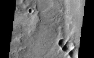<h1>PIA10329:  Triplet Crater</h1><div class="PIA10329" lang="en" style="width:547px;text-align:left;margin:auto;background-color:#000;padding:10px;max-height:150px;overflow:auto;"><p><a href="/figures/PIA10329_fig1.jpg"></a><br><b>Context image for PIA10329<br />Triplet Crater</b></p><p>It is not uncommon for multiple pieces of a meteor to impact Mars close together at the same time. When this happens, the craters that are formed overlap and the force of the impacts results in a linear wall separating the side-by-side form-at-the-same-time craters. This image shows where three craters were created simultaneously.<p>Image information: VIS instrument. Latitude -10.1N, Longitude 100.3E. 18 meter/pixel resolution.</p><p>Please see the <a href="http://themis.asu.edu/terms" target="_blank">THEMIS Data Citation Note</a> for details on crediting THEMIS images.</p><p>Note: this THEMIS visual image has not been radiometrically nor geometrically calibrated for this preliminary release. An empirical correction has been performed to remove instrumental effects. A linear shift has been applied in the cross-track and down-track direction to approximate spacecraft and planetary motion. Fully calibrated and geometrically projected images will be released through the Planetary Data System in accordance with Project policies at a later time.</p><p>NASA's Jet Propulsion Laboratory manages the 2001 Mars Odyssey mission for NASA's Office of Space Science, Washington, D.C. The Thermal Emission Imaging System (THEMIS) was developed by Arizona State University, Tempe, in collaboration with Raytheon Santa Barbara Remote Sensing. The THEMIS investigation is led by Dr. Philip Christensen at Arizona State University. Lockheed Martin Astronautics, Denver, is the prime contractor for the Odyssey project, and developed and built the orbiter. Mission operations are conducted jointly from Lockheed Martin and from JPL, a division of the California Institute of Technology in Pasadena.<br /><br /><a href="http://photojournal.jpl.nasa.gov/catalog/PIA10329" onclick="window.open(this.href); return false;" title="Voir l'image 	 PIA10329:  Triplet Crater	  sur le site de la NASA">Voir l'image 	 PIA10329:  Triplet Crater	  sur le site de la NASA.</a></div>