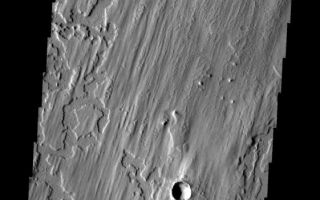<h1>PIA10332:  Elysium Planitia</h1><div class="PIA10332" lang="en" style="width:561px;text-align:left;margin:auto;background-color:#000;padding:10px;max-height:150px;overflow:auto;"><p><a href="/figures/PIA10332_fig1.jpg"></a><br><b>Context image for PIA10332<br />Elysium Planitia</b></p><p>This interesting surface texture is located in Elysium Planitia. The upper layer appears to have a linear pattern eroded into the material.<p>Image information: VIS instrument. Latitude 5.1N, Longitude 172.6E. 18 meter/pixel resolution.</p><p>Please see the <a href="http://themis.asu.edu/terms" target="_blank">THEMIS Data Citation Note</a> for details on crediting THEMIS images.</p><p>Note: this THEMIS visual image has not been radiometrically nor geometrically calibrated for this preliminary release. An empirical correction has been performed to remove instrumental effects. A linear shift has been applied in the cross-track and down-track direction to approximate spacecraft and planetary motion. Fully calibrated and geometrically projected images will be released through the Planetary Data System in accordance with Project policies at a later time.</p><p>NASA's Jet Propulsion Laboratory manages the 2001 Mars Odyssey mission for NASA's Office of Space Science, Washington, D.C. The Thermal Emission Imaging System (THEMIS) was developed by Arizona State University, Tempe, in collaboration with Raytheon Santa Barbara Remote Sensing. The THEMIS investigation is led by Dr. Philip Christensen at Arizona State University. Lockheed Martin Astronautics, Denver, is the prime contractor for the Odyssey project, and developed and built the orbiter. Mission operations are conducted jointly from Lockheed Martin and from JPL, a division of the California Institute of Technology in Pasadena.<br /><br /><a href="http://photojournal.jpl.nasa.gov/catalog/PIA10332" onclick="window.open(this.href); return false;" title="Voir l'image 	 PIA10332:  Elysium Planitia	  sur le site de la NASA">Voir l'image 	 PIA10332:  Elysium Planitia	  sur le site de la NASA.</a></div>