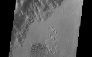 <h1>PIA10335:  Dunes</h1><div class="PIA10335" lang="en" style="width:537px;text-align:left;margin:auto;background-color:#000;padding:10px;max-height:150px;overflow:auto;"><p><a href="/figures/PIA10335_fig1.jpg"></a><br><b>Context image for PIA10335<br />Dunes</b></p><p>A field of sand dunes in located on the floor of this unnamed crater in Noachis Terra. Uzboi Valles runs along the western rim of this crater.<p>Image information: VIS instrument. Latitude -30.2N, Longitude 323.3E. 17 meter/pixel resolution.</p><p>Please see the <a href="http://themis.asu.edu/terms" target="_blank">THEMIS Data Citation Note</a> for details on crediting THEMIS images.</p><p>Note: this THEMIS visual image has not been radiometrically nor geometrically calibrated for this preliminary release. An empirical correction has been performed to remove instrumental effects. A linear shift has been applied in the cross-track and down-track direction to approximate spacecraft and planetary motion. Fully calibrated and geometrically projected images will be released through the Planetary Data System in accordance with Project policies at a later time.</p><p>NASA's Jet Propulsion Laboratory manages the 2001 Mars Odyssey mission for NASA's Office of Space Science, Washington, D.C. The Thermal Emission Imaging System (THEMIS) was developed by Arizona State University, Tempe, in collaboration with Raytheon Santa Barbara Remote Sensing. The THEMIS investigation is led by Dr. Philip Christensen at Arizona State University. Lockheed Martin Astronautics, Denver, is the prime contractor for the Odyssey project, and developed and built the orbiter. Mission operations are conducted jointly from Lockheed Martin and from JPL, a division of the California Institute of Technology in Pasadena.<br /><br /><a href="http://photojournal.jpl.nasa.gov/catalog/PIA10335" onclick="window.open(this.href); return false;" title="Voir l'image 	 PIA10335:  Dunes	  sur le site de la NASA">Voir l'image 	 PIA10335:  Dunes	  sur le site de la NASA.</a></div>