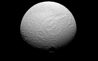 <h1>PIA10462:  Southern Face of Tethys</h1><div class="PIA10462" lang="en" style="width:800px;text-align:left;margin:auto;background-color:#000;padding:10px;max-height:150px;overflow:auto;"><p>Five hours after acquiring <a href="/catalog/PIA10460">PIA10460</a>, the Cassini spacecraft turned its cameras back to Tethys for a more southerly view. The southern reaches of Ithaca Chasma are seen here, along with the large crater Telemus just right of center.</p><p>Lit terrain seen here is on the Saturn-facing side of Tethys (1,062 kilometers, or 660 miles across). The view looks toward the southern hemisphere from a perspective 43 degrees south of the moon's equator. North is toward the top and rotated 30 degrees to the right.</p><p>The image was taken in visible green light with the Cassini spacecraft narrow-angle camera on July 28, 2008. The view was obtained at a distance of approximately 313,000 kilometers (194,000 miles) from Tethys and at a Sun-Tethys-spacecraft, or phase, angle of 42 degrees. Image scale is 2 kilometers (1 mile) per pixel.</p><p>The Cassini-Huygens mission is a cooperative project of NASA, the European Space Agency and the Italian Space Agency. The Jet Propulsion Laboratory, a division of the California Institute of Technology in Pasadena, manages the mission for NASA's Science Mission Directorate, Washington, D.C. The Cassini orbiter and its two onboard cameras were designed, developed and assembled at JPL. The imaging operations center is based at the Space Science Institute in Boulder, Colo.</p><p>For more information about the Cassini-Huygens mission visit <a href="http://saturn.jpl.nasa.gov" class="external free" target="wpext">http://saturn.jpl.nasa.gov/</a>. The Cassini imaging team homepage is at <a href="http://ciclops.org" class="external free" target="wpext">http://ciclops.org</a>.<br /><br /><a href="http://photojournal.jpl.nasa.gov/catalog/PIA10462" onclick="window.open(this.href); return false;" title="Voir l'image 	 PIA10462:  Southern Face of Tethys	  sur le site de la NASA">Voir l'image 	 PIA10462:  Southern Face of Tethys	  sur le site de la NASA.</a></div>