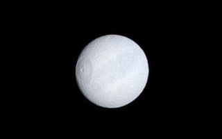<h1>PIA10538:  Tethys' Subtle Hues</h1><div class="PIA10538" lang="en" style="width:445px;text-align:left;margin:auto;background-color:#000;padding:10px;max-height:150px;overflow:auto;"><p>Tethys' dark equatorial band is seen in natural color on the moon's leading hemisphere. The largest impact basin on Tethys, Odysseus (400 kilometers, or 250 miles, across), appears on the left.</p><p>Images taken using red, green and blue spectral filters were combined to create this natural color view. The images were acquired with the Cassini spacecraft narrow-angle camera on Oct. 27, 2008 at a distance of approximately 1.203 million kilometers (747,500 miles) from Tethys and at a Sun-Tethys-spacecraft, or phase, angle of 10 degrees. Image scale is 7 kilometers (4 miles) per pixel.</p><p>The Cassini-Huygens mission is a cooperative project of NASA, the European Space Agency and the Italian Space Agency. The Jet Propulsion Laboratory, a division of the California Institute of Technology in Pasadena, manages the mission for NASA's Science Mission Directorate, Washington, D.C. The Cassini orbiter and its two onboard cameras were designed, developed and assembled at JPL. The imaging operations center is based at the Space Science Institute in Boulder, Colo.</p><p>For more information about the Cassini-Huygens mission visit <a href="http://saturn.jpl.nasa.gov" class="external free" target="wpext">http://saturn.jpl.nasa.gov/</a>. The Cassini imaging team homepage is at <a href="http://ciclops.org" class="external free" target="wpext">http://ciclops.org</a>.<br /><br /><a href="http://photojournal.jpl.nasa.gov/catalog/PIA10538" onclick="window.open(this.href); return false;" title="Voir l'image 	 PIA10538:  Tethys' Subtle Hues	  sur le site de la NASA">Voir l'image 	 PIA10538:  Tethys' Subtle Hues	  sur le site de la NASA.</a></div>