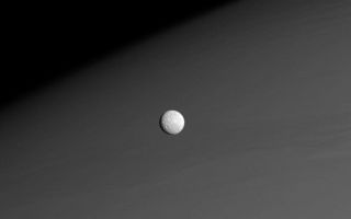 <h1>PIA10540:  Mimas Before Saturn</h1><div class="PIA10540" lang="en" style="width:800px;text-align:left;margin:auto;background-color:#000;padding:10px;max-height:150px;overflow:auto;"><p>Against a background of muted atmospheric bands in Saturn's northern hemisphere, Mimas forges onward in its orbit around the Ringed Planet.</p><p>Aside from the large crater Herschel (139 kilometers, or 87 miles across), all features on Mimas are named after people and places in Arthurian legend or the legends of the Titans. In fact, the largest crater near the terminator in this view is named Arthur (64 kilometers, or 40 miles across).</p><p>The image was taken in visible light with the Cassini spacecraft narrow-angle camera on Nov. 26, 2008 at a distance of approximately 915,000 kilometers (569,000 miles) from Mimas and at a Sun-Mimas-spacecraft, or phase, angle of 28 degrees. Image scale is 5 kilometers (3 miles) per pixel.</p><p>The Cassini-Huygens mission is a cooperative project of NASA, the European Space Agency and the Italian Space Agency. The Jet Propulsion Laboratory, a division of the California Institute of Technology in Pasadena, manages the mission for NASA's Science Mission Directorate, Washington, D.C. The Cassini orbiter and its two onboard cameras were designed, developed and assembled at JPL. The imaging operations center is based at the Space Science Institute in Boulder, Colo.</p><p>For more information about the Cassini-Huygens mission visit <a href="http://saturn.jpl.nasa.gov" class="external free" target="wpext">http://saturn.jpl.nasa.gov/</a>. The Cassini imaging team homepage is at <a href="http://ciclops.org" class="external free" target="wpext">http://ciclops.org</a>.<br /><br /><a href="http://photojournal.jpl.nasa.gov/catalog/PIA10540" onclick="window.open(this.href); return false;" title="Voir l'image 	 PIA10540:  Mimas Before Saturn	  sur le site de la NASA">Voir l'image 	 PIA10540:  Mimas Before Saturn	  sur le site de la NASA.</a></div>