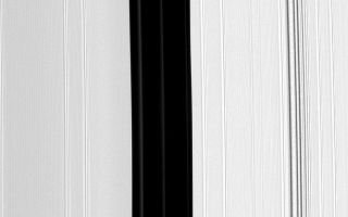 <h1>PIA10554:  Not-Quite-Empty Gap</h1><div class="PIA10554" lang="en" style="width:800px;text-align:left;margin:auto;background-color:#000;padding:10px;max-height:150px;overflow:auto;"><p>The Encke Gap, the broad, vertical dark band running down the center of this image, is maintained by the small moon Pan (not pictured). Pan also shepherds three ringlets, all of which appear here as faint, narrow bands within the Encke Gap. </p><p>The image was taken in visible light with the Cassini spacecraft narrow-angle camera on Aug. 19, 2008 at a distance of approximately 271,000 kilometers (168,000 miles) from Saturn and at a Sun-Saturn-spacecraft, or phase, angle of 138 degrees. Image scale is about 1 kilometer per pixel.</p><p>The Cassini-Huygens mission is a cooperative project of NASA, the European Space Agency and the Italian Space Agency. The Jet Propulsion Laboratory, a division of the California Institute of Technology in Pasadena, manages the mission for NASA's Science Mission Directorate, Washington, D.C. The Cassini orbiter and its two onboard cameras were designed, developed and assembled at JPL. The imaging operations center is based at the Space Science Institute in Boulder, Colo.</p><p>For more information about the Cassini-Huygens mission visit <a href="http://saturn.jpl.nasa.gov" class="external free" target="wpext">http://saturn.jpl.nasa.gov/</a>. The Cassini imaging team homepage is at <a href="http://ciclops.org" class="external free" target="wpext">http://ciclops.org</a>.<br /><br /><a href="http://photojournal.jpl.nasa.gov/catalog/PIA10554" onclick="window.open(this.href); return false;" title="Voir l'image 	 PIA10554:  Not-Quite-Empty Gap	  sur le site de la NASA">Voir l'image 	 PIA10554:  Not-Quite-Empty Gap	  sur le site de la NASA.</a></div>