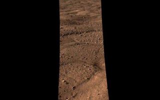 <h1>PIA10693:  Looking out Across the Martian Polar Plains</h1><div class="PIA10693" lang="en" style="width:640px;text-align:left;margin:auto;background-color:#000;padding:10px;max-height:150px;overflow:auto;"><p><a href="/archive/PIA10693.mov"></a><br />Click on the image for the animation</p><p>This movie shows the vast plains of the northern polar region of Mars, as seen by NASA's Phoenix Mars Lander shortly after touching down on the Red Planet. The flat landscape is strewn with tiny pebbles and shows polygonal cracking, a pattern seen widely in Martian high latitudes and also observed in permafrost terrains on Earth. The polygonal cracking is believed to have resulted from seasonal contraction and expansion of surface ice. </p><p>Phoenix touched down on Mars at 4:53 p.m. Pacific Time (7:53 p.m. Eastern Time), May 25, 2008, in an arctic region called Vastitas Borealis, at 68 degrees north latitude, 234 degrees east longitude. </p><p>This is an approximate-color image taken by the spacecraft's Surface Stereo Imager, inferred from two color filters, a violet, 450-nanometer filter and an infrared, 750-nanometer filter. </p><p>The Phoenix Mission is led by the University of Arizona, Tucson, on behalf of NASA. Project management of the mission is by NASA's Jet Propulsion Laboratory, Pasadena, Calif. Spacecraft development is by Lockheed Martin Space Systems, Denver.<br /><br /><a href="http://photojournal.jpl.nasa.gov/catalog/PIA10693" onclick="window.open(this.href); return false;" title="Voir l'image 	 PIA10693:  Looking out Across the Martian Polar Plains	  sur le site de la NASA">Voir l'image 	 PIA10693:  Looking out Across the Martian Polar Plains	  sur le site de la NASA.</a></div>