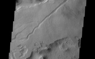 <h1>PIA10807:  Tharsis Winds</h1><div class="PIA10807" lang="en" style="width:553px;text-align:left;margin:auto;background-color:#000;padding:10px;max-height:150px;overflow:auto;"><p><a href="/figures/PIA10807_fig1.jpg"></a><br><b>Context image for PIA10807<br />Tharsis Winds</b></p><p>Although the Tharsis region of Mars is best known for its towering volcanoes and extensive lava flows the volcanic activity responsible ended long ago. Since then wind has been the active process, slowly eroding the surface and depositing fine materials. This image shows a small region of wind erosion and deposition in the Tharsis area.<p>Image information: VIS instrument. Latitude 7.6N, Longitude 232.6E. 18 meter/pixel resolution.</p><p>Please see the <a href="http://themis.asu.edu/terms" target="_blank">THEMIS Data Citation Note</a> for details on crediting THEMIS images.</p><p>Note: this THEMIS visual image has not been radiometrically nor geometrically calibrated for this preliminary release. An empirical correction has been performed to remove instrumental effects. A linear shift has been applied in the cross-track and down-track direction to approximate spacecraft and planetary motion. Fully calibrated and geometrically projected images will be released through the Planetary Data System in accordance with Project policies at a later time.</p><p>NASA's Jet Propulsion Laboratory manages the 2001 Mars Odyssey mission for NASA's Office of Space Science, Washington, D.C. The Thermal Emission Imaging System (THEMIS) was developed by Arizona State University, Tempe, in collaboration with Raytheon Santa Barbara Remote Sensing. The THEMIS investigation is led by Dr. Philip Christensen at Arizona State University. Lockheed Martin Astronautics, Denver, is the prime contractor for the Odyssey project, and developed and built the orbiter. Mission operations are conducted jointly from Lockheed Martin and from JPL, a division of the California Institute of Technology in Pasadena.<br /><br /><a href="http://photojournal.jpl.nasa.gov/catalog/PIA10807" onclick="window.open(this.href); return false;" title="Voir l'image 	 PIA10807:  Tharsis Winds	  sur le site de la NASA">Voir l'image 	 PIA10807:  Tharsis Winds	  sur le site de la NASA.</a></div>