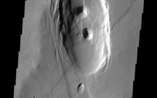 <h1>PIA10816:  Collapse</h1><div class="PIA10816" lang="en" style="width:564px;text-align:left;margin:auto;background-color:#000;padding:10px;max-height:150px;overflow:auto;"><p><a href="/figures/PIA10816_fig1.jpg"></a><br><b>Context image for PIA10816<br />Collapse</b></p><p>Alba Patera is a very large old volcano on the surface of Mars. While still impressive in height, it no longer towers over the surrounding plains. It is thought that after a major eruption that emptied the magma chamber beneath Alba Patera the entire volcano collapsed into the empty space below. This collapse is marked by extensive fracturing. This VIS image shows collapse on a much smaller scale.<p>Image information: VIS instrument. Latitude 35.5N, Longitude 245.4E. 19 meter/pixel resolution.</p><p>Please see the <a href="http://themis.asu.edu/terms" target="_blank">THEMIS Data Citation Note</a> for details on crediting THEMIS images.</p><p>Note: this THEMIS visual image has not been radiometrically nor geometrically calibrated for this preliminary release. An empirical correction has been performed to remove instrumental effects. A linear shift has been applied in the cross-track and down-track direction to approximate spacecraft and planetary motion. Fully calibrated and geometrically projected images will be released through the Planetary Data System in accordance with Project policies at a later time.</p><p>NASA's Jet Propulsion Laboratory manages the 2001 Mars Odyssey mission for NASA's Office of Space Science, Washington, D.C. The Thermal Emission Imaging System (THEMIS) was developed by Arizona State University, Tempe, in collaboration with Raytheon Santa Barbara Remote Sensing. The THEMIS investigation is led by Dr. Philip Christensen at Arizona State University. Lockheed Martin Astronautics, Denver, is the prime contractor for the Odyssey project, and developed and built the orbiter. Mission operations are conducted jointly from Lockheed Martin and from JPL, a division of the California Institute of Technology in Pasadena.<br /><br /><a href="http://photojournal.jpl.nasa.gov/catalog/PIA10816" onclick="window.open(this.href); return false;" title="Voir l'image 	 PIA10816:  Collapse	  sur le site de la NASA">Voir l'image 	 PIA10816:  Collapse	  sur le site de la NASA.</a></div>