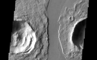 <h1>PIA10817:  Lava Channel</h1><div class="PIA10817" lang="en" style="width:561px;text-align:left;margin:auto;background-color:#000;padding:10px;max-height:150px;overflow:auto;"><p><a href="/figures/PIA10817_fig1.jpg"></a><br><b>Context image for PIA10817<br />Lava Channel</b></p><p>The channel that cuts between these two craters is Marte Valles, a lava channel.<p>Image information: VIS instrument. Latitude 16.7N, Longitude 184.9E. 18 meter/pixel resolution.</p><p>Please see the <a href="http://themis.asu.edu/terms" target="_blank">THEMIS Data Citation Note</a> for details on crediting THEMIS images.</p><p>Note: this THEMIS visual image has not been radiometrically nor geometrically calibrated for this preliminary release. An empirical correction has been performed to remove instrumental effects. A linear shift has been applied in the cross-track and down-track direction to approximate spacecraft and planetary motion. Fully calibrated and geometrically projected images will be released through the Planetary Data System in accordance with Project policies at a later time.</p><p>NASA's Jet Propulsion Laboratory manages the 2001 Mars Odyssey mission for NASA's Office of Space Science, Washington, D.C. The Thermal Emission Imaging System (THEMIS) was developed by Arizona State University, Tempe, in collaboration with Raytheon Santa Barbara Remote Sensing. The THEMIS investigation is led by Dr. Philip Christensen at Arizona State University. Lockheed Martin Astronautics, Denver, is the prime contractor for the Odyssey project, and developed and built the orbiter. Mission operations are conducted jointly from Lockheed Martin and from JPL, a division of the California Institute of Technology in Pasadena.<br /><br /><a href="http://photojournal.jpl.nasa.gov/catalog/PIA10817" onclick="window.open(this.href); return false;" title="Voir l'image 	 PIA10817:  Lava Channel	  sur le site de la NASA">Voir l'image 	 PIA10817:  Lava Channel	  sur le site de la NASA.</a></div>