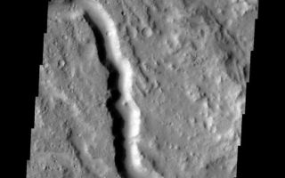 <h1>PIA10827:  Channel</h1><div class="PIA10827" lang="en" style="width:551px;text-align:left;margin:auto;background-color:#000;padding:10px;max-height:150px;overflow:auto;"><p><a href="/figures/PIA10827_fig1.jpg"></a><br><b>Context image for PIA10827<br />Channel</b></p><p>This image shows one of the many channels located in Lybia Montes, the highlands bordering the southern portion of Isidis Plainitia.<p>Image information: VIS instrument. Latitude 0.7N, Longitude 89.3E. 18 meter/pixel resolution.</p><p>Please see the <a href="http://themis.asu.edu/terms" target="_blank">THEMIS Data Citation Note</a> for details on crediting THEMIS images.</p><p>Note: this THEMIS visual image has not been radiometrically nor geometrically calibrated for this preliminary release. An empirical correction has been performed to remove instrumental effects. A linear shift has been applied in the cross-track and down-track direction to approximate spacecraft and planetary motion. Fully calibrated and geometrically projected images will be released through the Planetary Data System in accordance with Project policies at a later time.</p><p>NASA's Jet Propulsion Laboratory manages the 2001 Mars Odyssey mission for NASA's Office of Space Science, Washington, D.C. The Thermal Emission Imaging System (THEMIS) was developed by Arizona State University, Tempe, in collaboration with Raytheon Santa Barbara Remote Sensing. The THEMIS investigation is led by Dr. Philip Christensen at Arizona State University. Lockheed Martin Astronautics, Denver, is the prime contractor for the Odyssey project, and developed and built the orbiter. Mission operations are conducted jointly from Lockheed Martin and from JPL, a division of the California Institute of Technology in Pasadena.<br /><br /><a href="http://photojournal.jpl.nasa.gov/catalog/PIA10827" onclick="window.open(this.href); return false;" title="Voir l'image 	 PIA10827:  Channel	  sur le site de la NASA">Voir l'image 	 PIA10827:  Channel	  sur le site de la NASA.</a></div>