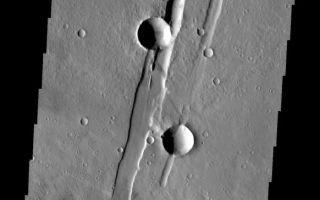 <h1>PIA10838:  THEMIS ART #93</h1><div class="PIA10838" lang="en" style="width:582px;text-align:left;margin:auto;background-color:#000;padding:10px;max-height:150px;overflow:auto;"><p><a href="/figures/PIA10838_fig1.jpg"></a><br><b>Context image for PIA10838<br />THEMIS ART #93</b></p><p>Two craters on a graben, or for those of us old enough to remember - the handset for a telephone.<p>Image information: VIS instrument. Latitude 20.4N, Longitude 243.5E. 18 meter/pixel resolution.</p><p>Please see the <a href="http://themis.asu.edu/terms" target="_blank">THEMIS Data Citation Note</a> for details on crediting THEMIS images.</p><p>Note: this THEMIS visual image has not been radiometrically nor geometrically calibrated for this preliminary release. An empirical correction has been performed to remove instrumental effects. A linear shift has been applied in the cross-track and down-track direction to approximate spacecraft and planetary motion. Fully calibrated and geometrically projected images will be released through the Planetary Data System in accordance with Project policies at a later time.</p><p>NASA's Jet Propulsion Laboratory manages the 2001 Mars Odyssey mission for NASA's Office of Space Science, Washington, D.C. The Thermal Emission Imaging System (THEMIS) was developed by Arizona State University, Tempe, in collaboration with Raytheon Santa Barbara Remote Sensing. The THEMIS investigation is led by Dr. Philip Christensen at Arizona State University. Lockheed Martin Astronautics, Denver, is the prime contractor for the Odyssey project, and developed and built the orbiter. Mission operations are conducted jointly from Lockheed Martin and from JPL, a division of the California Institute of Technology in Pasadena.<br /><br /><a href="http://photojournal.jpl.nasa.gov/catalog/PIA10838" onclick="window.open(this.href); return false;" title="Voir l'image 	 PIA10838:  THEMIS ART #93	  sur le site de la NASA">Voir l'image 	 PIA10838:  THEMIS ART #93	  sur le site de la NASA.</a></div>