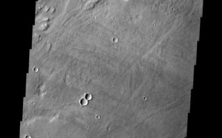 <h1>PIA10850:  Tharsis Lavas</h1><div class="PIA10850" lang="en" style="width:561px;text-align:left;margin:auto;background-color:#000;padding:10px;max-height:150px;overflow:auto;"><p><a href="/figures/PIA10850_fig1.jpg"></a><br><b>Context image for PIA10850<br />Tharsis Lavas</b></p><p>The many lava flows in this VIS image are part of the extensive Tharsis volcanic complex. These flows appear to originate in the region of Alba Patera and flowed downhill towards Olympus Mons.<p>Image information: VIS instrument. Latitude 25.1N, Longitude 236.4E. 19 meter/pixel resolution.</p><p>Please see the <a href="http://themis.asu.edu/terms" target="_blank">THEMIS Data Citation Note</a> for details on crediting THEMIS images.</p><p>Note: this THEMIS visual image has not been radiometrically nor geometrically calibrated for this preliminary release. An empirical correction has been performed to remove instrumental effects. A linear shift has been applied in the cross-track and down-track direction to approximate spacecraft and planetary motion. Fully calibrated and geometrically projected images will be released through the Planetary Data System in accordance with Project policies at a later time.</p><p>NASA's Jet Propulsion Laboratory manages the 2001 Mars Odyssey mission for NASA's Office of Space Science, Washington, D.C. The Thermal Emission Imaging System (THEMIS) was developed by Arizona State University, Tempe, in collaboration with Raytheon Santa Barbara Remote Sensing. The THEMIS investigation is led by Dr. Philip Christensen at Arizona State University. Lockheed Martin Astronautics, Denver, is the prime contractor for the Odyssey project, and developed and built the orbiter. Mission operations are conducted jointly from Lockheed Martin and from JPL, a division of the California Institute of Technology in Pasadena.<br /><br /><a href="http://photojournal.jpl.nasa.gov/catalog/PIA10850" onclick="window.open(this.href); return false;" title="Voir l'image 	 PIA10850:  Tharsis Lavas	  sur le site de la NASA">Voir l'image 	 PIA10850:  Tharsis Lavas	  sur le site de la NASA.</a></div>