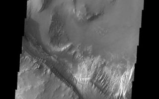<h1>PIA10851:  Melas Chasma</h1><div class="PIA10851" lang="en" style="width:546px;text-align:left;margin:auto;background-color:#000;padding:10px;max-height:150px;overflow:auto;"><p><a href="/figures/PIA10851_fig1.jpg"></a><br><b>Context image for PIA10851<br />Melas Chasma</b></p><p>This VIS image shows part of the layered deposits found in Melas Chasma.<p>Image information: VIS instrument. Latitude -12.1N, Longitude 288.3E. 17 meter/pixel resolution.</p><p>Please see the <a href="http://themis.asu.edu/terms" target="_blank">THEMIS Data Citation Note</a> for details on crediting THEMIS images.</p><p>Note: this THEMIS visual image has not been radiometrically nor geometrically calibrated for this preliminary release. An empirical correction has been performed to remove instrumental effects. A linear shift has been applied in the cross-track and down-track direction to approximate spacecraft and planetary motion. Fully calibrated and geometrically projected images will be released through the Planetary Data System in accordance with Project policies at a later time.</p><p>NASA's Jet Propulsion Laboratory manages the 2001 Mars Odyssey mission for NASA's Office of Space Science, Washington, D.C. The Thermal Emission Imaging System (THEMIS) was developed by Arizona State University, Tempe, in collaboration with Raytheon Santa Barbara Remote Sensing. The THEMIS investigation is led by Dr. Philip Christensen at Arizona State University. Lockheed Martin Astronautics, Denver, is the prime contractor for the Odyssey project, and developed and built the orbiter. Mission operations are conducted jointly from Lockheed Martin and from JPL, a division of the California Institute of Technology in Pasadena.<br /><br /><a href="http://photojournal.jpl.nasa.gov/catalog/PIA10851" onclick="window.open(this.href); return false;" title="Voir l'image 	 PIA10851:  Melas Chasma	  sur le site de la NASA">Voir l'image 	 PIA10851:  Melas Chasma	  sur le site de la NASA.</a></div>