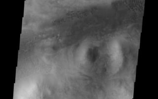 <h1>PIA10860:  Dunes</h1><div class="PIA10860" lang="en" style="width:578px;text-align:left;margin:auto;background-color:#000;padding:10px;max-height:150px;overflow:auto;"><p><a href="/figures/PIA10860_fig1.jpg"></a><br><b>Context image for PIA10860<br />Dunes</b></p><p>These dark dunes are located west of Barabashov Crater on the northern margin of Tempe Terra.<p>Image information: VIS instrument. Latitude 50.3N, Longitude 289.5E. 19 meter/pixel resolution.</p><p>Please see the <a href="http://themis.asu.edu/terms" target="_blank">THEMIS Data Citation Note</a> for details on crediting THEMIS images.</p><p>Note: this THEMIS visual image has not been radiometrically nor geometrically calibrated for this preliminary release. An empirical correction has been performed to remove instrumental effects. A linear shift has been applied in the cross-track and down-track direction to approximate spacecraft and planetary motion. Fully calibrated and geometrically projected images will be released through the Planetary Data System in accordance with Project policies at a later time.</p><p>NASA's Jet Propulsion Laboratory manages the 2001 Mars Odyssey mission for NASA's Office of Space Science, Washington, D.C. The Thermal Emission Imaging System (THEMIS) was developed by Arizona State University, Tempe, in collaboration with Raytheon Santa Barbara Remote Sensing. The THEMIS investigation is led by Dr. Philip Christensen at Arizona State University. Lockheed Martin Astronautics, Denver, is the prime contractor for the Odyssey project, and developed and built the orbiter. Mission operations are conducted jointly from Lockheed Martin and from JPL, a division of the California Institute of Technology in Pasadena.<br /><br /><a href="http://photojournal.jpl.nasa.gov/catalog/PIA10860" onclick="window.open(this.href); return false;" title="Voir l'image 	 PIA10860:  Dunes	  sur le site de la NASA">Voir l'image 	 PIA10860:  Dunes	  sur le site de la NASA.</a></div>