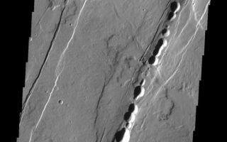 <h1>PIA10865:  Alba Patera</h1><div class="PIA10865" lang="en" style="width:579px;text-align:left;margin:auto;background-color:#000;padding:10px;max-height:150px;overflow:auto;"><p><a href="/figures/PIA10865_fig1.jpg"></a><br><b>Context image for PIA10865<br />Alba Patera</b></p><p>The ancient collapsed volcano, Alba Patera, is surrounded by graben and collapse features termed catenae. The 'string-of-prearl' appearance of the catenae is caused by collapse controlled by the fractures at the margins.<p>Image information: VIS instrument. Latitude 35.9N, Longitude 258.1E. 19 meter/pixel resolution.</p><p>Please see the <a href="http://themis.asu.edu/terms" target="_blank">THEMIS Data Citation Note</a> for details on crediting THEMIS images.</p><p>Note: this THEMIS visual image has not been radiometrically nor geometrically calibrated for this preliminary release. An empirical correction has been performed to remove instrumental effects. A linear shift has been applied in the cross-track and down-track direction to approximate spacecraft and planetary motion. Fully calibrated and geometrically projected images will be released through the Planetary Data System in accordance with Project policies at a later time.</p><p>NASA's Jet Propulsion Laboratory manages the 2001 Mars Odyssey mission for NASA's Office of Space Science, Washington, D.C. The Thermal Emission Imaging System (THEMIS) was developed by Arizona State University, Tempe, in collaboration with Raytheon Santa Barbara Remote Sensing. The THEMIS investigation is led by Dr. Philip Christensen at Arizona State University. Lockheed Martin Astronautics, Denver, is the prime contractor for the Odyssey project, and developed and built the orbiter. Mission operations are conducted jointly from Lockheed Martin and from JPL, a division of the California Institute of Technology in Pasadena.<br /><br /><a href="http://photojournal.jpl.nasa.gov/catalog/PIA10865" onclick="window.open(this.href); return false;" title="Voir l'image 	 PIA10865:  Alba Patera	  sur le site de la NASA">Voir l'image 	 PIA10865:  Alba Patera	  sur le site de la NASA.</a></div>