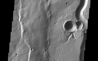 <h1>PIA10880:  Buvinda Vallis</h1><div class="PIA10880" lang="en" style="width:563px;text-align:left;margin:auto;background-color:#000;padding:10px;max-height:150px;overflow:auto;"><p><a href="/figures/PIA10880_fig1.jpg"></a><br><b>Context image for PIA10880<br />Buvinda Vallis</b></p><p>This channel is associated with Hecates Tholus, part of the Elysium volcanic complex.<p>Image information: VIS instrument. Latitude 32.4N, Longitude 152.0E. 19 meter/pixel resolution.</p><p>Please see the <a href="http://themis.asu.edu/terms" target="_blank">THEMIS Data Citation Note</a> for details on crediting THEMIS images.</p><p>Note: this THEMIS visual image has not been radiometrically nor geometrically calibrated for this preliminary release. An empirical correction has been performed to remove instrumental effects. A linear shift has been applied in the cross-track and down-track direction to approximate spacecraft and planetary motion. Fully calibrated and geometrically projected images will be released through the Planetary Data System in accordance with Project policies at a later time.</p><p>NASA's Jet Propulsion Laboratory manages the 2001 Mars Odyssey mission for NASA's Office of Space Science, Washington, D.C. The Thermal Emission Imaging System (THEMIS) was developed by Arizona State University, Tempe, in collaboration with Raytheon Santa Barbara Remote Sensing. The THEMIS investigation is led by Dr. Philip Christensen at Arizona State University. Lockheed Martin Astronautics, Denver, is the prime contractor for the Odyssey project, and developed and built the orbiter. Mission operations are conducted jointly from Lockheed Martin and from JPL, a division of the California Institute of Technology in Pasadena.<br /><br /><a href="http://photojournal.jpl.nasa.gov/catalog/PIA10880" onclick="window.open(this.href); return false;" title="Voir l'image 	 PIA10880:  Buvinda Vallis	  sur le site de la NASA">Voir l'image 	 PIA10880:  Buvinda Vallis	  sur le site de la NASA.</a></div>