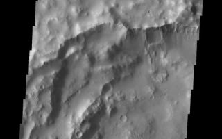 <h1>PIA10890:  Landslide</h1><div class="PIA10890" lang="en" style="width:556px;text-align:left;margin:auto;background-color:#000;padding:10px;max-height:150px;overflow:auto;"><p><a href="/figures/PIA10890_fig1.jpg"></a><br><b>Context image for PIA10890<br />Landslide</b></p><p>The landslide seen in this VIS image is located in an unnamed crater in Arabia Terra.<p>Image information: VIS instrument. Latitude 13.3N, Longitude 341.9E. 18 meter/pixel resolution.</p><p>Please see the <a href="http://themis.asu.edu/terms" target="_blank">THEMIS Data Citation Note</a> for details on crediting THEMIS images.</p><p>Note: this THEMIS visual image has not been radiometrically nor geometrically calibrated for this preliminary release. An empirical correction has been performed to remove instrumental effects. A linear shift has been applied in the cross-track and down-track direction to approximate spacecraft and planetary motion. Fully calibrated and geometrically projected images will be released through the Planetary Data System in accordance with Project policies at a later time.</p><p>NASA's Jet Propulsion Laboratory manages the 2001 Mars Odyssey mission for NASA's Office of Space Science, Washington, D.C. The Thermal Emission Imaging System (THEMIS) was developed by Arizona State University, Tempe, in collaboration with Raytheon Santa Barbara Remote Sensing. The THEMIS investigation is led by Dr. Philip Christensen at Arizona State University. Lockheed Martin Astronautics, Denver, is the prime contractor for the Odyssey project, and developed and built the orbiter. Mission operations are conducted jointly from Lockheed Martin and from JPL, a division of the California Institute of Technology in Pasadena.<br /><br /><a href="http://photojournal.jpl.nasa.gov/catalog/PIA10890" onclick="window.open(this.href); return false;" title="Voir l'image 	 PIA10890:  Landslide	  sur le site de la NASA">Voir l'image 	 PIA10890:  Landslide	  sur le site de la NASA.</a></div>