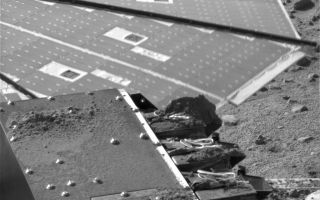 <h1>PIA11129:  Soil on Phoenix's MECA</h1><div class="PIA11129" lang="en" style="width:800px;text-align:left;margin:auto;background-color:#000;padding:10px;max-height:150px;overflow:auto;"><p>This image shows soil delivery to NASA's Phoenix Mars Lander's Microscopy, Electrochemistry and Conductivity Analyzer (MECA). The image was taken by the lander's Surface Stereo Imager on the 131st Martian day, or sol, of the mission (Oct. 7, 2008).</p><p>At the bottom of the image is the chute for delivering samples to MECA's microscopes. It is relatively clean due to the Phoenix team using methods such as sprinkling to minimize cross-contamination of samples. However, the cumulative effect of several sample deliveries can be seen in the soil piles on either side of the chute.</p><p>On the right side are the four chemistry cells with soil residue piled up on exposed surfaces. The farthest cell has a large pile of material from an area of the Phoenix workspace called "Stone Soup." This area is deep in the trough at a polygon boundary, and its soil was so sticky it wouldn't even go through the funnel.</p><p>One of Phoenix's solar panels is shown in the background of this image.</p><p>The Phoenix Mission is led by the University of Arizona, Tucson, on behalf of NASA. Project management of the mission is by NASA's Jet Propulsion Laboratory, Pasadena, Calif. Spacecraft development is by Lockheed Martin Space Systems, Denver.<br /><br /><a href="http://photojournal.jpl.nasa.gov/catalog/PIA11129" onclick="window.open(this.href); return false;" title="Voir l'image 	 PIA11129:  Soil on Phoenix's MECA	  sur le site de la NASA">Voir l'image 	 PIA11129:  Soil on Phoenix's MECA	  sur le site de la NASA.</a></div>