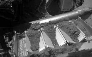<h1>PIA11236:  Soil Fills Phoenix Laboratory Cell</h1><div class="PIA11236" lang="en" style="width:512px;text-align:left;margin:auto;background-color:#000;padding:10px;max-height:150px;overflow:auto;"><p>This image shows four of the eight cells in the Thermal and Evolved-Gas Analyzer, or TEGA, on NASA's Phoenix Mars Lander. TEGA's ovens, located underneath the cells, heat soil samples so the released gases can be analyzed.</p><p>Left to right, the cells are numbered 7, 6, 5 and 4. Phoenix's Robotic Arm delivered soil most recently to cell 6 on the 137th Martian day, or sol, of the mission (Oct. 13, 2008).</p><p>Phoenix's Robotic Arm Camera took this image at 3:03 p.m. local solar time on Sol 138 (Oct. 14, 2008).</p><p>Phoenix landed on Mars' northern plains on May 25, 2008.</p><p>The Phoenix Mission is led by the University of Arizona, Tucson, on behalf of NASA. Project management of the mission is by NASA's Jet Propulsion Laboratory, Pasadena, Calif. Spacecraft development is by Lockheed Martin Space Systems, Denver.<br /><br /><a href="http://photojournal.jpl.nasa.gov/catalog/PIA11236" onclick="window.open(this.href); return false;" title="Voir l'image 	 PIA11236:  Soil Fills Phoenix Laboratory Cell	  sur le site de la NASA">Voir l'image 	 PIA11236:  Soil Fills Phoenix Laboratory Cell	  sur le site de la NASA.</a></div>