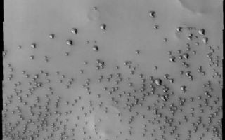 <h1>PIA11256:  Polar Dunes</h1><div class="PIA11256" lang="en" style="width:467px;text-align:left;margin:auto;background-color:#000;padding:10px;max-height:150px;overflow:auto;"><p><a href="/figures/PIA11256_fig1.jpg"></a><br><b>Context image for PIA11256<br />Polar Dunes</b></p><p>This VIS image shows a region of dunes near the north polar cap that are individual dune forms.</p><p>Image information: VIS instrument. Latitude 74.3N, Longitude 308.2E. 19 meter/pixel resolution.</p><p>Please see the <a href="http://themis.asu.edu/terms" target="_blank">THEMIS Data Citation Note</a> for details on crediting THEMIS images.</p><p>Note: this THEMIS visual image has not been radiometrically nor geometrically calibrated for this preliminary release. An empirical correction has been performed to remove instrumental effects. A linear shift has been applied in the cross-track and down-track direction to approximate spacecraft and planetary motion. Fully calibrated and geometrically projected images will be released through the Planetary Data System in accordance with Project policies at a later time.</p><p>NASA's Jet Propulsion Laboratory manages the 2001 Mars Odyssey mission for NASA's Office of Space Science, Washington, D.C. The Thermal Emission Imaging System (THEMIS) was developed by Arizona State University, Tempe, in collaboration with Raytheon Santa Barbara Remote Sensing. The THEMIS investigation is led by Dr. Philip Christensen at Arizona State University. Lockheed Martin Astronautics, Denver, is the prime contractor for the Odyssey project, and developed and built the orbiter. Mission operations are conducted jointly from Lockheed Martin and from JPL, a division of the California Institute of Technology in Pasadena.<br /><br /><a href="http://photojournal.jpl.nasa.gov/catalog/PIA11256" onclick="window.open(this.href); return false;" title="Voir l'image 	 PIA11256:  Polar Dunes	  sur le site de la NASA">Voir l'image 	 PIA11256:  Polar Dunes	  sur le site de la NASA.</a></div>