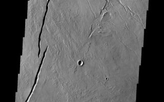 <h1>PIA11280:  Volcano</h1><div class="PIA11280" lang="en" style="width:548px;text-align:left;margin:auto;background-color:#000;padding:10px;max-height:150px;overflow:auto;"><p><a href="/figures/PIA11280_fig1.png"></a><br><b>Context image for PIA11280<br />Volcano</b></p><p>This small volcano formed at one of the numerous volcanic vents located in the Tharsis region.<p>Image information: VIS instrument. Latitude 5.0N, Longitude 254.6E. 18 meter/pixel resolution.</p><p>Please see the <a href="http://themis.asu.edu/terms" target="_blank">THEMIS Data Citation Note</a> for details on crediting THEMIS images.</p><p>Note: this THEMIS visual image has not been radiometrically nor geometrically calibrated for this preliminary release. An empirical correction has been performed to remove instrumental effects. A linear shift has been applied in the cross-track and down-track direction to approximate spacecraft and planetary motion. Fully calibrated and geometrically projected images will be released through the Planetary Data System in accordance with Project policies at a later time.</p><p>NASA's Jet Propulsion Laboratory manages the 2001 Mars Odyssey mission for NASA's Office of Space Science, Washington, D.C. The Thermal Emission Imaging System (THEMIS) was developed by Arizona State University, Tempe, in collaboration with Raytheon Santa Barbara Remote Sensing. The THEMIS investigation is led by Dr. Philip Christensen at Arizona State University. Lockheed Martin Astronautics, Denver, is the prime contractor for the Odyssey project, and developed and built the orbiter. Mission operations are conducted jointly from Lockheed Martin and from JPL, a division of the California Institute of Technology in Pasadena.<br /><br /><a href="http://photojournal.jpl.nasa.gov/catalog/PIA11280" onclick="window.open(this.href); return false;" title="Voir l'image 	 PIA11280:  Volcano	  sur le site de la NASA">Voir l'image 	 PIA11280:  Volcano	  sur le site de la NASA.</a></div>