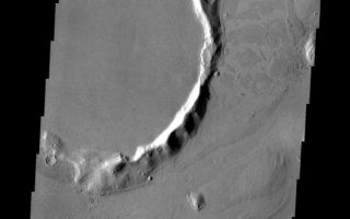 <h1>PIA11284:  Platy Lava Flow</h1><div class="PIA11284" lang="en" style="width:567px;text-align:left;margin:auto;background-color:#000;padding:10px;max-height:150px;overflow:auto;"><p><a href="/figures/PIA11284_fig1.png"></a><br><b>Context image for PIA11284<br />Platy Lava Flow</b></p><p>The 'tongue' of platy lava located on the eastern side of the crater and spilling towards the north is the margin of an extensive lava field within Amazonis Planitia.<p>Image information: VIS instrument. Latitude 23.5N, Longitude 189.2E. 19 meter/pixel resolution.</p><p>Please see the <a href="http://themis.asu.edu/terms" target="_blank">THEMIS Data Citation Note</a> for details on crediting THEMIS images.</p><p>Note: this THEMIS visual image has not been radiometrically nor geometrically calibrated for this preliminary release. An empirical correction has been performed to remove instrumental effects. A linear shift has been applied in the cross-track and down-track direction to approximate spacecraft and planetary motion. Fully calibrated and geometrically projected images will be released through the Planetary Data System in accordance with Project policies at a later time.</p><p>NASA's Jet Propulsion Laboratory manages the 2001 Mars Odyssey mission for NASA's Office of Space Science, Washington, D.C. The Thermal Emission Imaging System (THEMIS) was developed by Arizona State University, Tempe, in collaboration with Raytheon Santa Barbara Remote Sensing. The THEMIS investigation is led by Dr. Philip Christensen at Arizona State University. Lockheed Martin Astronautics, Denver, is the prime contractor for the Odyssey project, and developed and built the orbiter. Mission operations are conducted jointly from Lockheed Martin and from JPL, a division of the California Institute of Technology in Pasadena.<br /><br /><a href="http://photojournal.jpl.nasa.gov/catalog/PIA11284" onclick="window.open(this.href); return false;" title="Voir l'image 	 PIA11284:  Platy Lava Flow	  sur le site de la NASA">Voir l'image 	 PIA11284:  Platy Lava Flow	  sur le site de la NASA.</a></div>