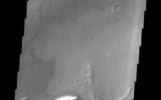 <h1>PIA11288:  Ganges Chasma</h1><div class="PIA11288" lang="en" style="width:555px;text-align:left;margin:auto;background-color:#000;padding:10px;max-height:150px;overflow:auto;"><p><a href="/figures/PIA11288_fig1.png"></a><br><b>Context image for PIA11288<br />Ganges Chasma</b></p><p>This image shows a small portion of the floor of Ganges Chasma. Visible in this image are sand dunes, a sand sheet with dune forms and eroded bright deposits.<p>Image information: VIS instrument. Latitude -8.4N, Longitude 314.0E. 18 meter/pixel resolution.</p><p>Please see the <a href="http://themis.asu.edu/terms" target="_blank">THEMIS Data Citation Note</a> for details on crediting THEMIS images.</p><p>Note: this THEMIS visual image has not been radiometrically nor geometrically calibrated for this preliminary release. An empirical correction has been performed to remove instrumental effects. A linear shift has been applied in the cross-track and down-track direction to approximate spacecraft and planetary motion. Fully calibrated and geometrically projected images will be released through the Planetary Data System in accordance with Project policies at a later time.</p><p>NASA's Jet Propulsion Laboratory manages the 2001 Mars Odyssey mission for NASA's Office of Space Science, Washington, D.C. The Thermal Emission Imaging System (THEMIS) was developed by Arizona State University, Tempe, in collaboration with Raytheon Santa Barbara Remote Sensing. The THEMIS investigation is led by Dr. Philip Christensen at Arizona State University. Lockheed Martin Astronautics, Denver, is the prime contractor for the Odyssey project, and developed and built the orbiter. Mission operations are conducted jointly from Lockheed Martin and from JPL, a division of the California Institute of Technology in Pasadena.<br /><br /><a href="http://photojournal.jpl.nasa.gov/catalog/PIA11288" onclick="window.open(this.href); return false;" title="Voir l'image 	 PIA11288:  Ganges Chasma	  sur le site de la NASA">Voir l'image 	 PIA11288:  Ganges Chasma	  sur le site de la NASA.</a></div>