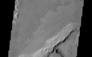<h1>PIA11290:  Volcanic Vent</h1><div class="PIA11290" lang="en" style="width:560px;text-align:left;margin:auto;background-color:#000;padding:10px;max-height:150px;overflow:auto;"><p><a href="/figures/PIA11290_fig1.png"></a><br><b>Context image for PIA11290<br />Volcanic Vent</b></p><p>The volcanic vent and related flows in this image are located in Elysium Planitia.<p>Image information: VIS instrument. Latitude 7.2N, Longitude 156.8E. 18 meter/pixel resolution.</p><p>Please see the <a href="http://themis.asu.edu/terms" target="_blank">THEMIS Data Citation Note</a> for details on crediting THEMIS images.</p><p>Note: this THEMIS visual image has not been radiometrically nor geometrically calibrated for this preliminary release. An empirical correction has been performed to remove instrumental effects. A linear shift has been applied in the cross-track and down-track direction to approximate spacecraft and planetary motion. Fully calibrated and geometrically projected images will be released through the Planetary Data System in accordance with Project policies at a later time.</p><p>NASA's Jet Propulsion Laboratory manages the 2001 Mars Odyssey mission for NASA's Office of Space Science, Washington, D.C. The Thermal Emission Imaging System (THEMIS) was developed by Arizona State University, Tempe, in collaboration with Raytheon Santa Barbara Remote Sensing. The THEMIS investigation is led by Dr. Philip Christensen at Arizona State University. Lockheed Martin Astronautics, Denver, is the prime contractor for the Odyssey project, and developed and built the orbiter. Mission operations are conducted jointly from Lockheed Martin and from JPL, a division of the California Institute of Technology in Pasadena.<br /><br /><a href="http://photojournal.jpl.nasa.gov/catalog/PIA11290" onclick="window.open(this.href); return false;" title="Voir l'image 	 PIA11290:  Volcanic Vent	  sur le site de la NASA">Voir l'image 	 PIA11290:  Volcanic Vent	  sur le site de la NASA.</a></div>