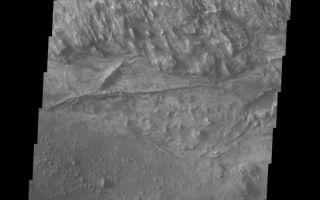 <h1>PIA11291:  Candor Chasma</h1><div class="PIA11291" lang="en" style="width:547px;text-align:left;margin:auto;background-color:#000;padding:10px;max-height:150px;overflow:auto;"><p><a href="/figures/PIA11291_fig1.png"></a><br><b>Context image for PIA11291<br />Candor Chasma</b></p><p>This VIS image shows part of the floor of Candor Chasma.<p>Image information: VIS instrument. Latitude -6.6N, Longitude 284.2E. 18 meter/pixel resolution.</p><p>Please see the <a href="http://themis.asu.edu/terms" target="_blank">THEMIS Data Citation Note</a> for details on crediting THEMIS images.</p><p>Note: this THEMIS visual image has not been radiometrically nor geometrically calibrated for this preliminary release. An empirical correction has been performed to remove instrumental effects. A linear shift has been applied in the cross-track and down-track direction to approximate spacecraft and planetary motion. Fully calibrated and geometrically projected images will be released through the Planetary Data System in accordance with Project policies at a later time.</p><p>NASA's Jet Propulsion Laboratory manages the 2001 Mars Odyssey mission for NASA's Office of Space Science, Washington, D.C. The Thermal Emission Imaging System (THEMIS) was developed by Arizona State University, Tempe, in collaboration with Raytheon Santa Barbara Remote Sensing. The THEMIS investigation is led by Dr. Philip Christensen at Arizona State University. Lockheed Martin Astronautics, Denver, is the prime contractor for the Odyssey project, and developed and built the orbiter. Mission operations are conducted jointly from Lockheed Martin and from JPL, a division of the California Institute of Technology in Pasadena.<br /><br /><a href="http://photojournal.jpl.nasa.gov/catalog/PIA11291" onclick="window.open(this.href); return false;" title="Voir l'image 	 PIA11291:  Candor Chasma	  sur le site de la NASA">Voir l'image 	 PIA11291:  Candor Chasma	  sur le site de la NASA.</a></div>