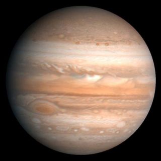 <h1>PIA00343:  Jupiter</h1><div class="PIA00343" lang="en" style="width:800px;text-align:left;margin:auto;background-color:#000;padding:10px;max-height:150px;overflow:auto;">This processed color image of Jupiter was produced in 1990 by the U.S. Geological Survey from a Voyager image captured in 1979. The colors have been enhanced to bring out detail. Zones of light-colored, ascending clouds alternate with bands of dark, descending clouds. The clouds travel around the planet in alternating eastward and westward belts at speeds of up to 540 kilometers per hour. Tremendous storms as big as Earthly continents surge around the planet. The Great Red Spot (oval shape toward the lower-left) is an enormous anticyclonic storm that drifts along its belt, eventually circling the entire planet.<br /><br /><a href="http://photojournal.jpl.nasa.gov/catalog/PIA00343" onclick="window.open(this.href); return false;" title="Voir l'image 	 PIA00343:  Jupiter	  sur le site de la NASA">Voir l'image 	 PIA00343:  Jupiter	  sur le site de la NASA.</a></div>