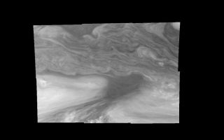 <h1>PIA01210:  Jupiter's Equatorial Region in a Methane band (Time set 4)</h1><div class="PIA01210" lang="en" style="width:800px;text-align:left;margin:auto;background-color:#000;padding:10px;max-height:150px;overflow:auto;">Mosaic of Jupiter's equatorial region at 727 nanometers (nm). The mosaic covers an area of 34,000 kilometers by 22,000 kilometers. Light at 727 nm is moderately absorbed by atmospheric methane. This image shows the features of Jupiter's main visible cloud deck and upper-tropospheric haze, with higher features enhanced in brightness over lower features. The dark region near the center of the mosaic is an equatorial "hotspot" similar to the Galileo Probe entry site. These features are holes in the bright, reflective, equatorial cloud layer where warmer thermal emission from Jupiter's deep atmosphere can pass through. The circulation patterns observed here along with the composition measurements from the Galileo Probe suggest that dry air may be converging and sinking over these regions, maintaining their cloud-free appearance. The bright oval in the upper right of the mosaic as well as the other smaller bright features are examples of upwelling of moist air and condensation.<p>North is at the top. The mosaic covers latitudes 1 to 19 degrees and is centered at longitude 336 degrees West. The smallest resolved features are tens of kilometers in size. These images were taken on December 17, 1996, at a range of 1.5 million kilometers by the Solid State Imaging system aboard NASA's Galileo spacecraft.<p>The Jet Propulsion Laboratory, Pasadena, CA manages the mission for NASA's Office of Space Science, Washington, DC.<p>This image and other images and data received from Galileo are posted on the World Wide Web, on the Galileo mission home page at URL http://galileo.jpl.nasa.gov. Background information and educational context for the images can be found at <a href="http://www2.jpl.nasa.gov/galileo/sepo/" target="_blank">http://www.jpl.nasa.gov/galileo/sepo</a>..<br /><br /><a href="http://photojournal.jpl.nasa.gov/catalog/PIA01210" onclick="window.open(this.href); return false;" title="Voir l'image 	 PIA01210:  Jupiter's Equatorial Region in a Methane band (Time set 4)	  sur le site de la NASA">Voir l'image 	 PIA01210:  Jupiter's Equatorial Region in a Methane band (Time set 4)	  sur le site de la NASA.</a></div>