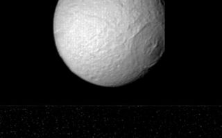 <h1>PIA01385:  Pictures of Tethys' large crater.</h1><div class="PIA01385" lang="en" style="width:514px;text-align:left;margin:auto;background-color:#000;padding:10px;max-height:150px;overflow:auto;">This series of Voyager 2 pictures of Tethys shows its distinctive large crater, 400 kilometers (250 miles) in diameter, as it rotates toward the termination and limb of this satellite of Saturn. These images were obtained at four-hour intervals beginning late Aug. 24 and ending early the next day; the distances were 1.1 million km. (670,000 mi.), 826,000 km. (510,000 mi.) and 680,000 km. (420,000 mi.), respectively. The crater, the remnant of a large impact, has a central peak and several concentric rings. Some grooves radiating from the center may be formed of material thrown from the crater during the impact. The bottom frame, with the crater in profile, reveals that its floor has risen back to the spherical shape of the satellite, unlike the large crater seen on Tethys sister moon Mimas. The Voyager project is managed for NASA by the Jet Propulsion Laboratory, Pasadena, Calif.<br /><br /><a href="http://photojournal.jpl.nasa.gov/catalog/PIA01385" onclick="window.open(this.href); return false;" title="Voir l'image 	 PIA01385:  Pictures of Tethys' large crater.	  sur le site de la NASA">Voir l'image 	 PIA01385:  Pictures of Tethys' large crater.	  sur le site de la NASA.</a></div>